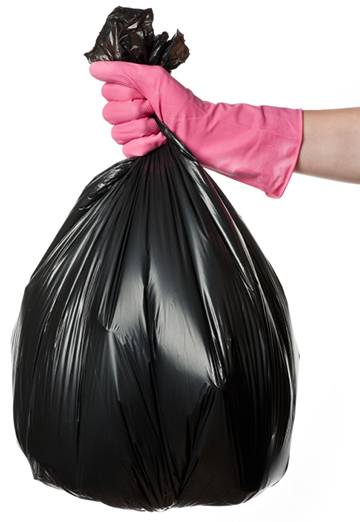 Hand holding trash bag