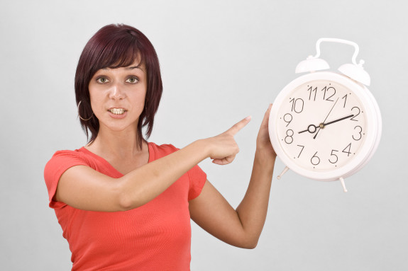 Woman Holding Clock