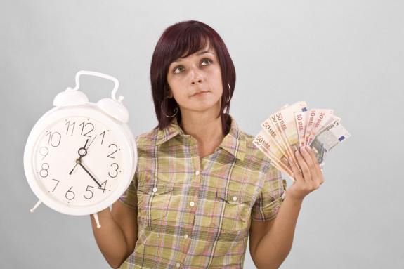Woman Holding Clock And Money