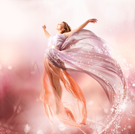 Fairy. Beautiful Girl in Blowing Dress Flying. Magic