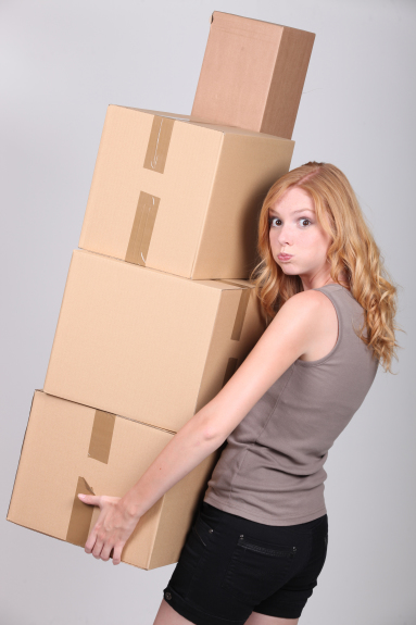 Woman carrying heavy boxes