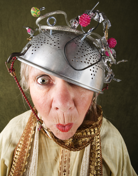 Crazy woman wearing a metal colander for a helmet