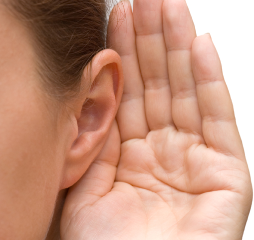 Girl listening with her hand on an ear